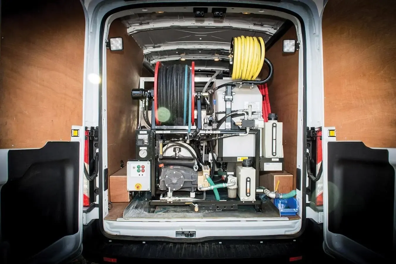 High-pressure water jetting equipment installed in the back of a Drain Medics service van